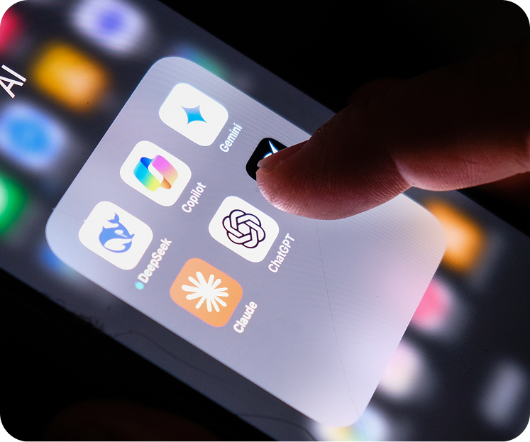 Smartphone displaying AI app icons including ChatGPT, Gemini, Copilot, Claude and DeepSeek, with a finger tapping the screen